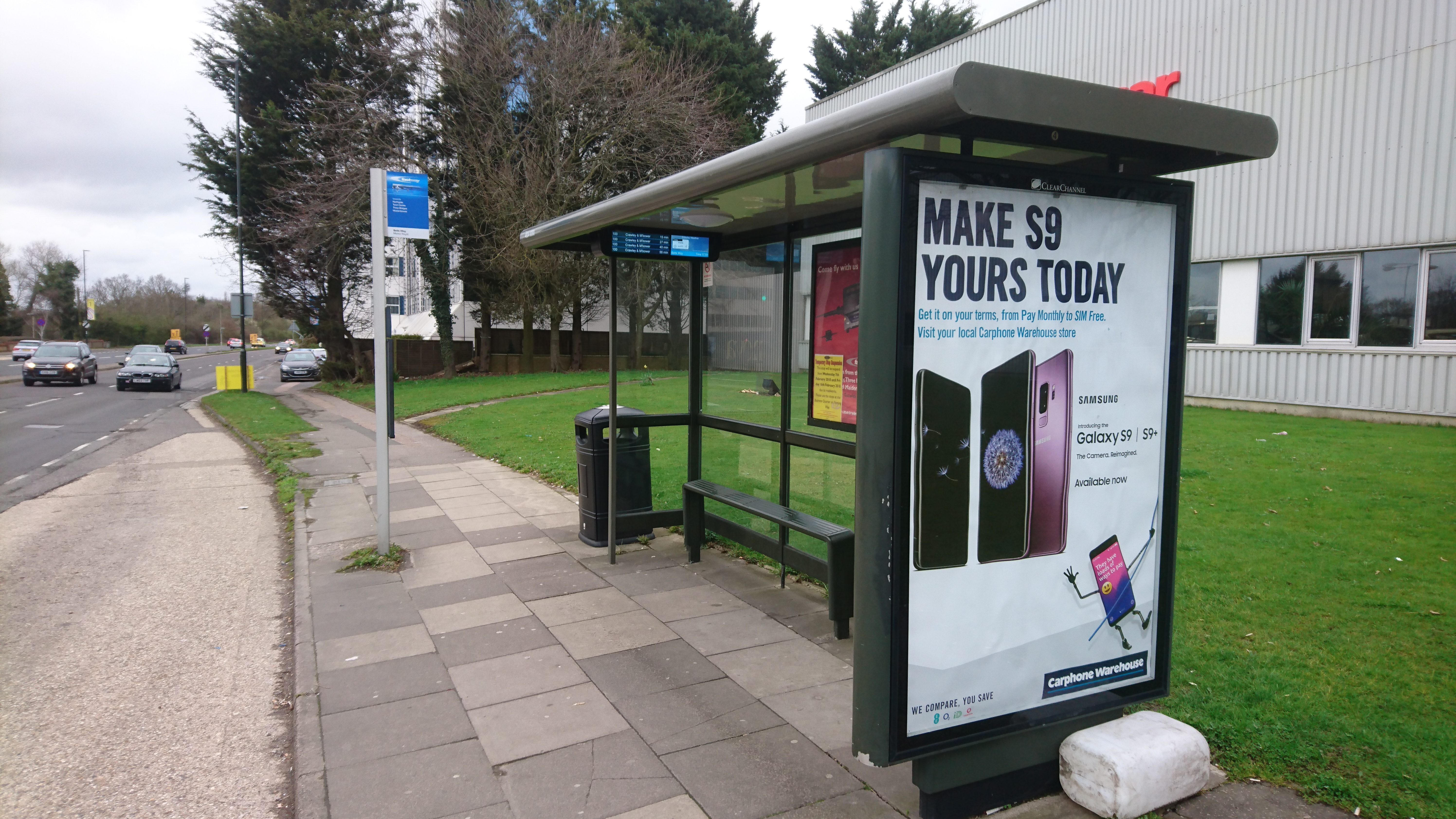 Bus stop in crawley with flag and electronic display