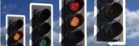 Traffic Lights in row showing red, amber and green